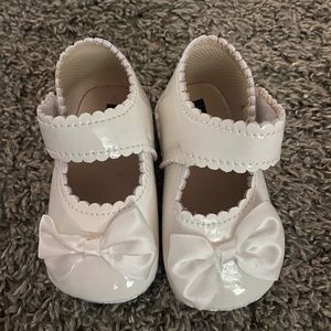 White patent leather baby shoes
